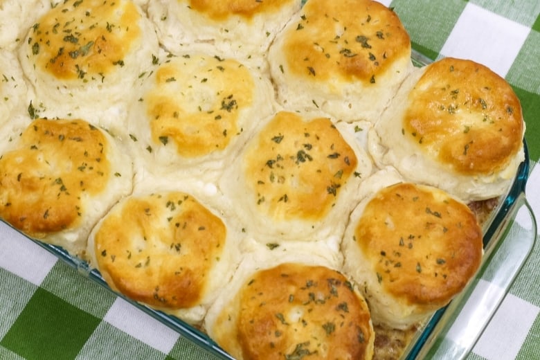 large casserole dish filled with golden brown biscuits