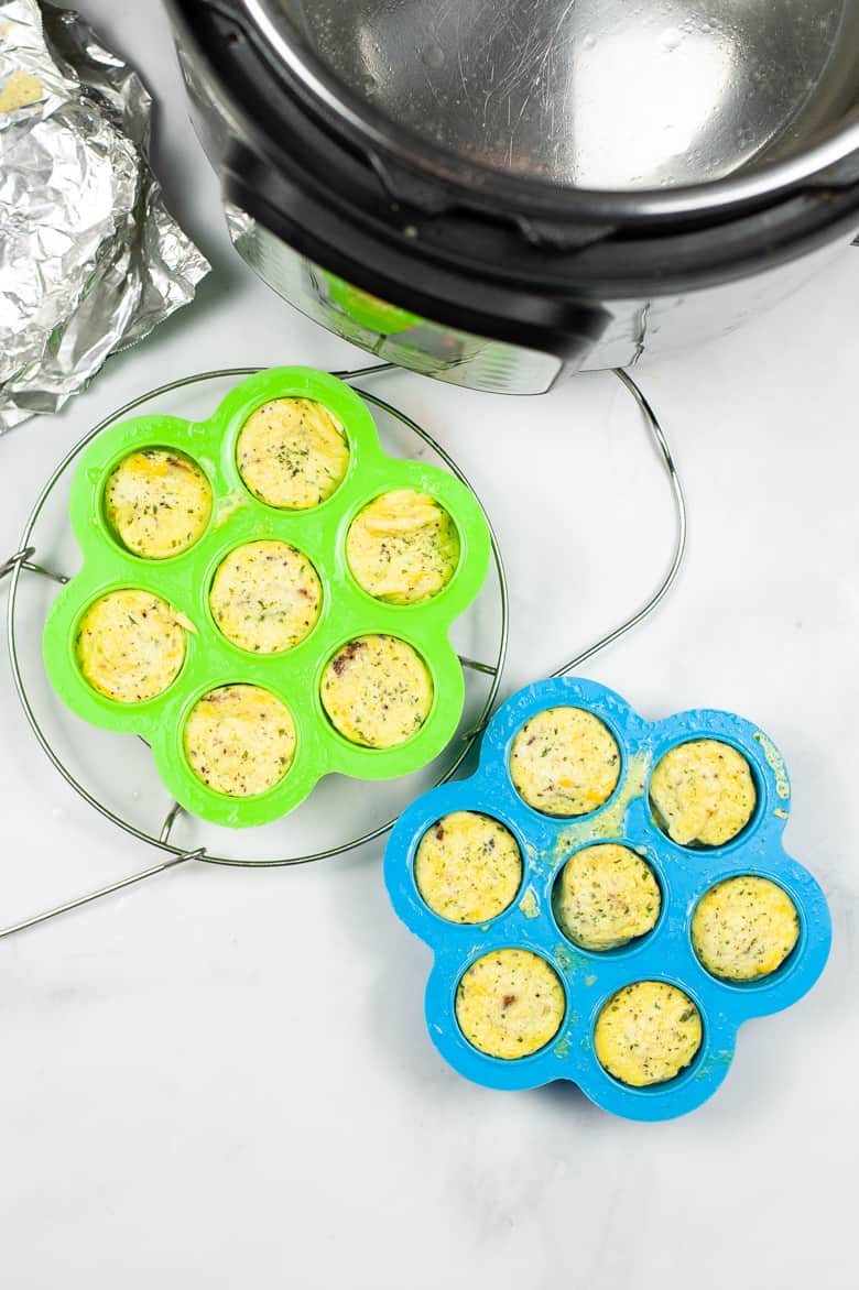 Egg bites in silicone molds next to Instant Pot