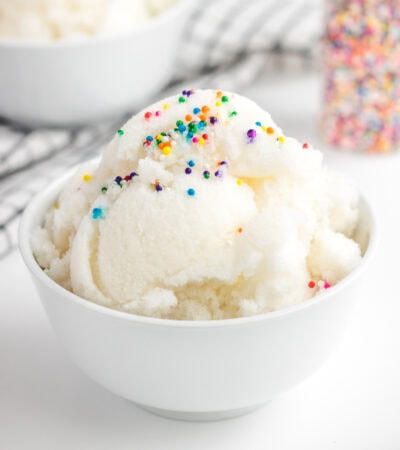 snow ice cream with rainbow sprinkles in a white bowl