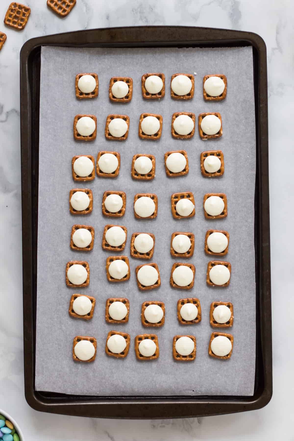 Pretzels topped with softened white chocolate