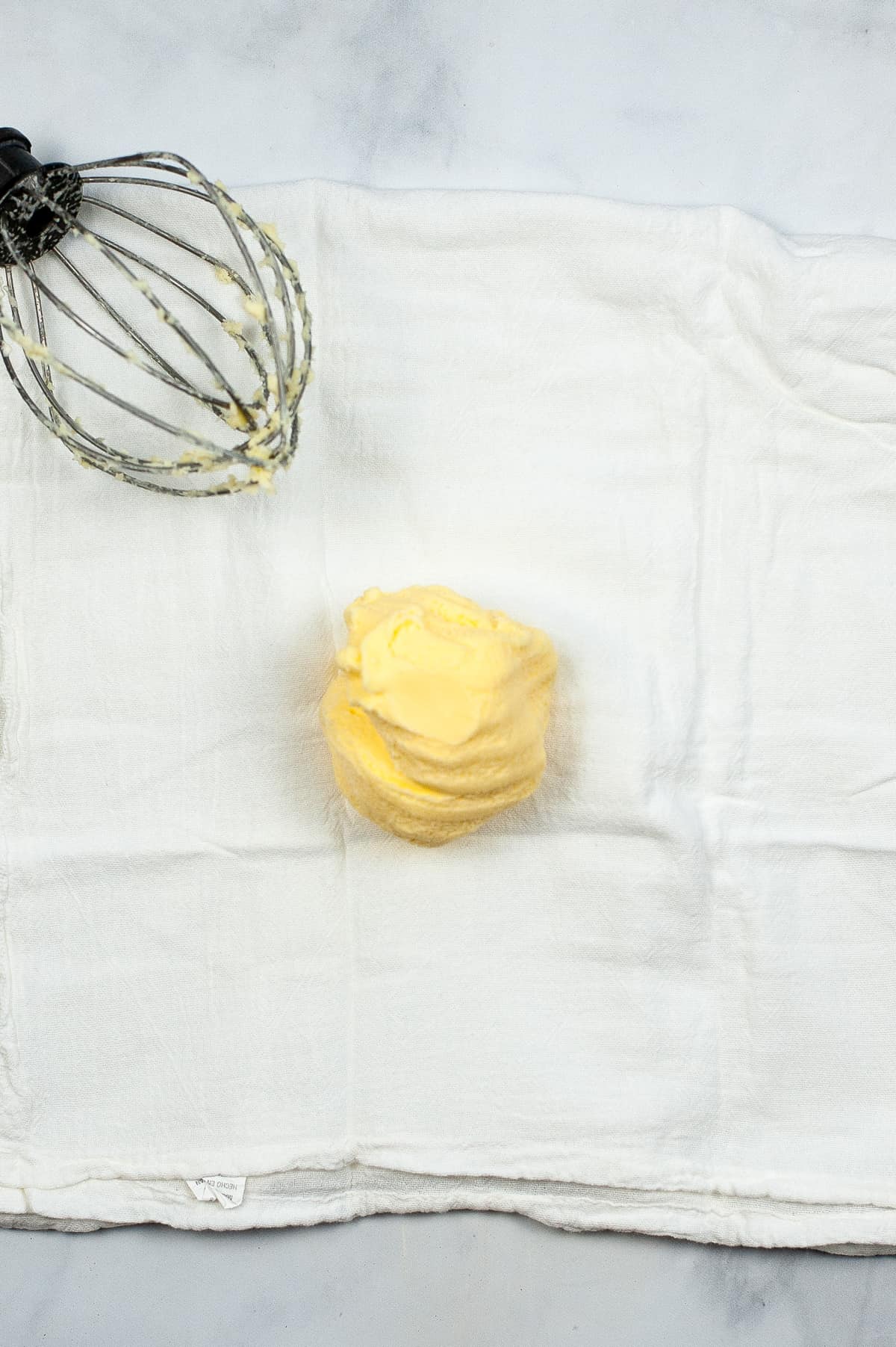 Ball of butter in center of cheesecloth