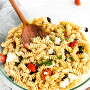 Greek Pasta Salad with feta cheese, olives, cherry tomatoes, and fresh parsley