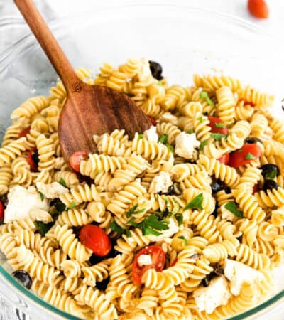 Greek Pasta Salad with feta cheese, olives, cherry tomatoes, and fresh parsley