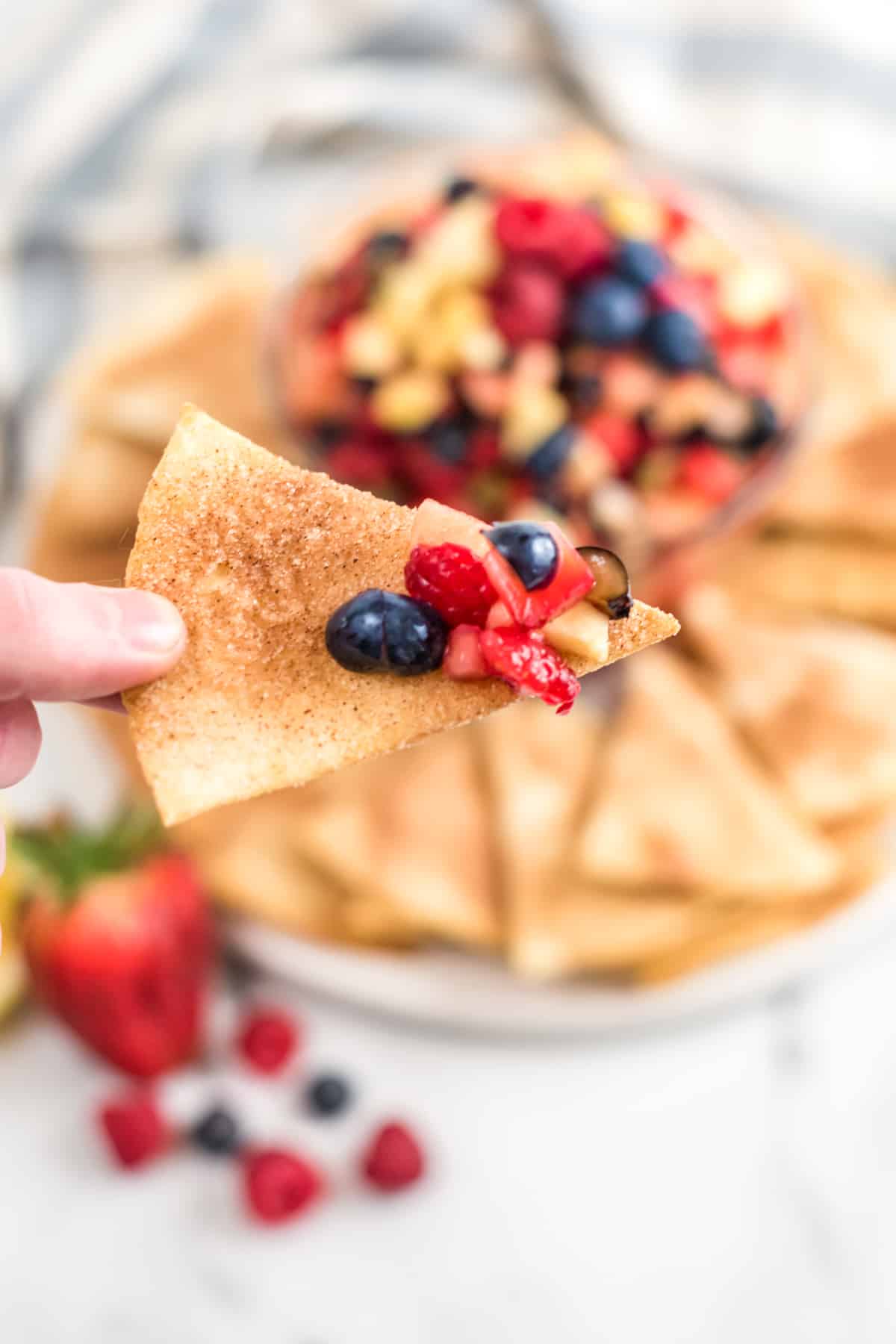 Homemade cinnamon chip with chopped fruit salsa on it