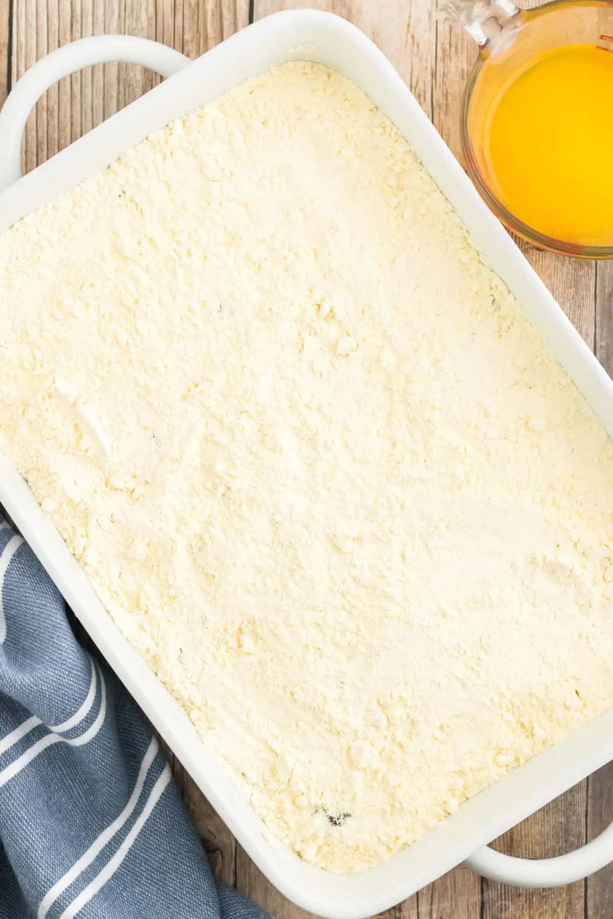 Cake mix covering pie filling in baking dish.