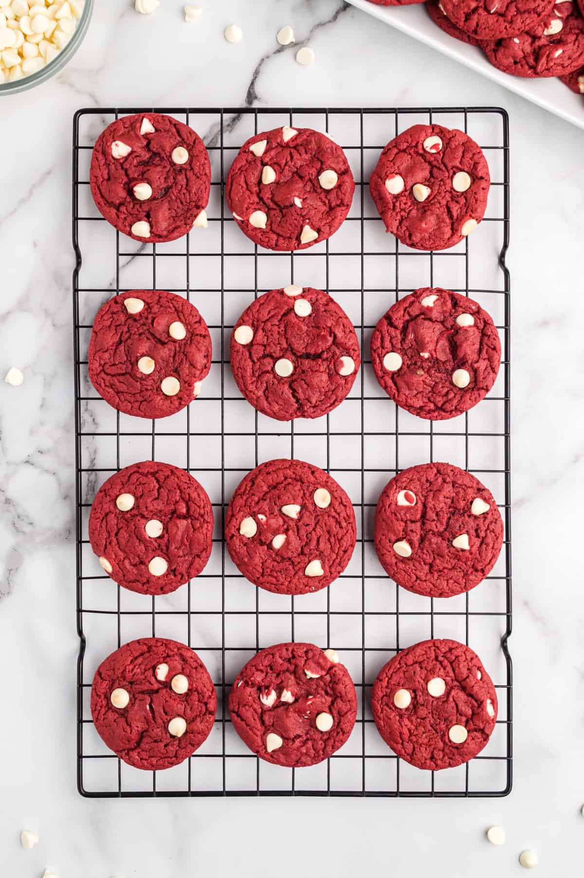 red velvet cake mix cookies with white chocolate chips on cooling rack