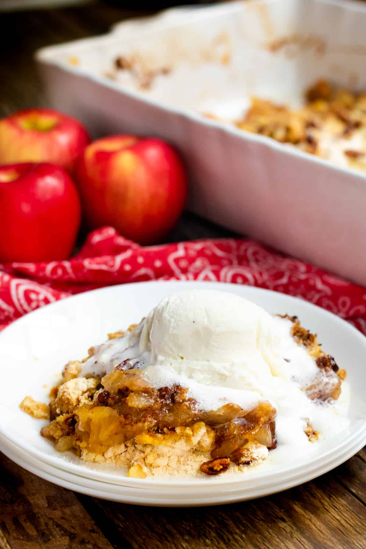 Apple spice dump cake topped with melted ice cream