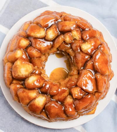 Monkey bread made in bundt pan covered in buttery brown sugar sauce