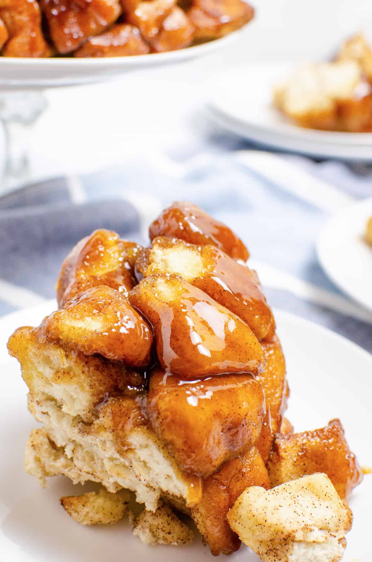 Chunk of monkey bread on white plate.