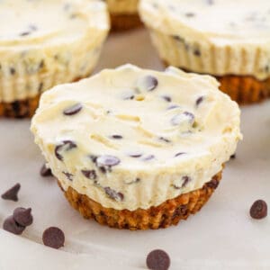 Mini Chocolate Chip Cookie Dough Cheesecakes with cookie crust and creamy chocolate chip cheesecake filling
