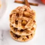 Apple pie cookies stacked on top of one another