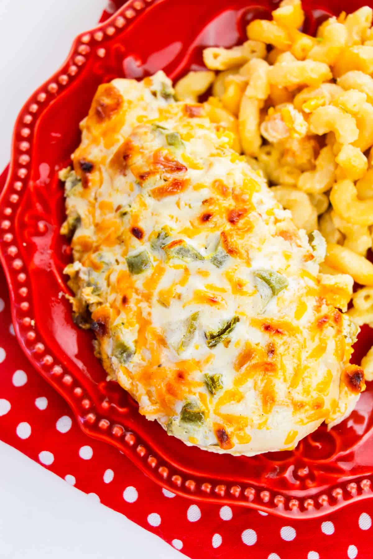 Chicken breast topped with creamy jalapeno topping served with mac and cheese