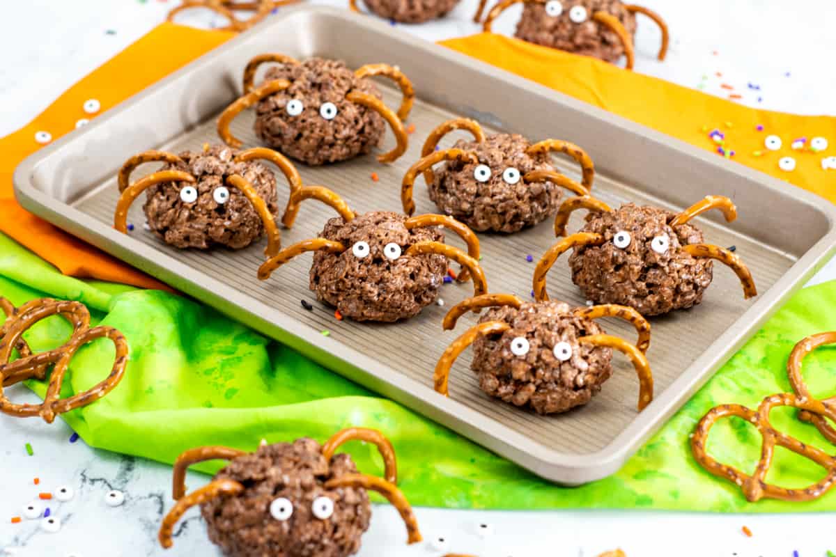 Chocolate rice krispies spider treats with pretzel legs and candy eyes