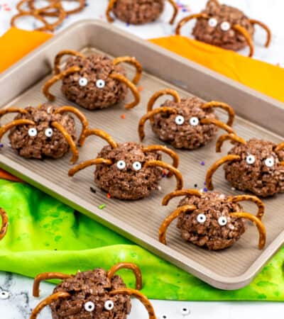 Chocolate rice krispies spider treats with pretzel legs and candy eyes
