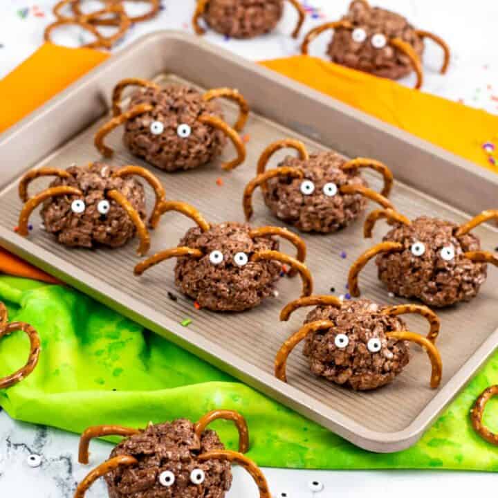 Chocolate rice krispies spider treats with pretzel legs and candy eyes