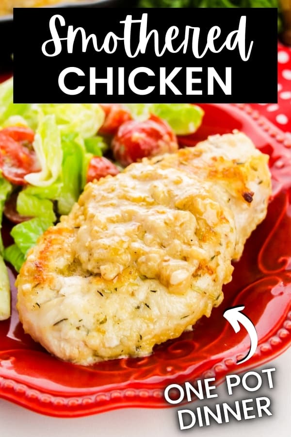 Image of smothered chicken on red plate with side of salad. Text on image reads: Smothered Chicken, one pot dinner