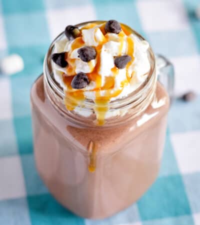 Boozy hot chocolate with caramel vodka, whipped cream, caramel sauce, and chocolate chips.