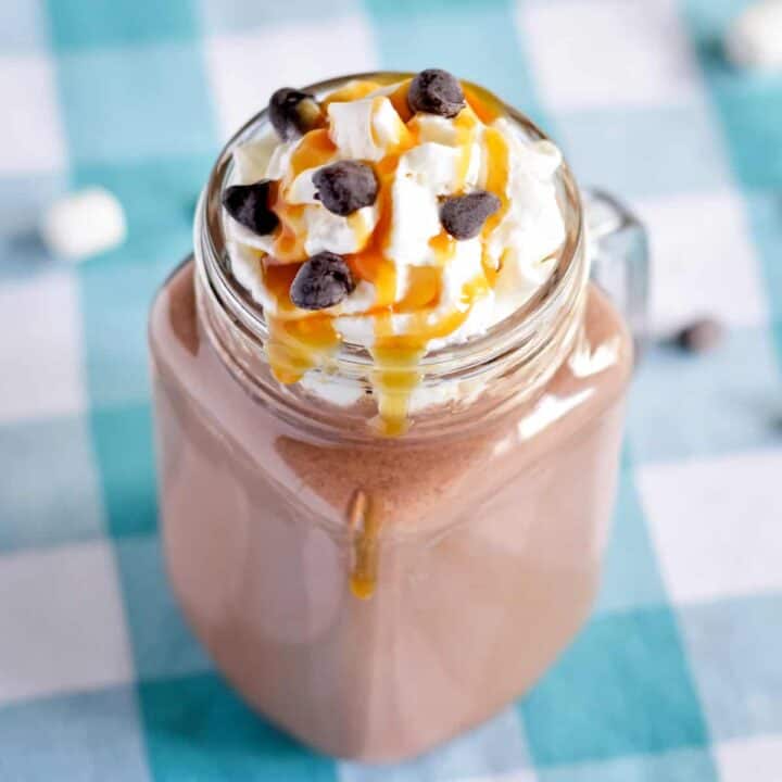 Boozy hot chocolate with caramel vodka, whipped cream, caramel sauce, and chocolate chips.