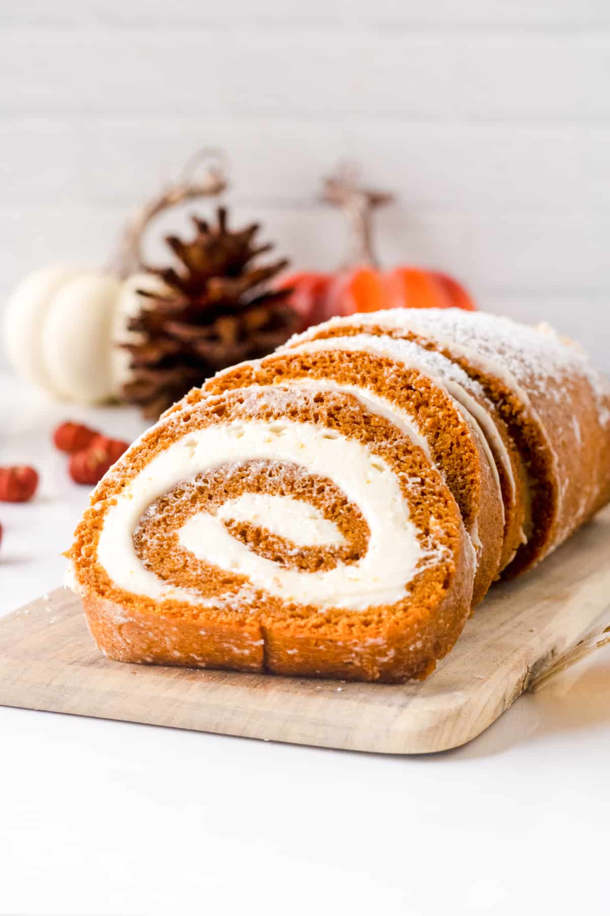 Pumpkin roll cake with cream cheese filling