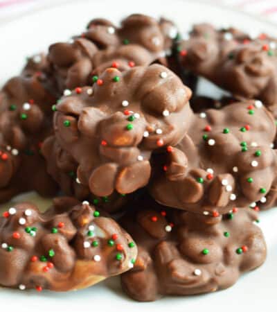 Chocolate and peanut crockpot candy with christmas sprinkles