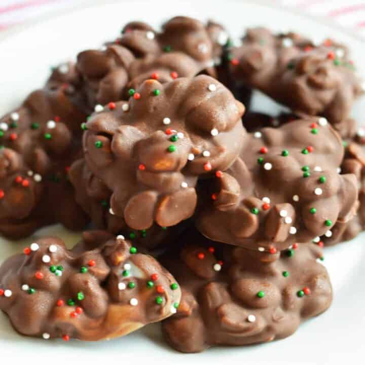 Chocolate and peanut crockpot candy with christmas sprinkles