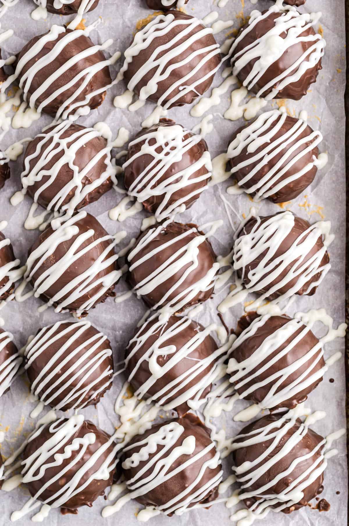 Rice Krispie Buckeyes drizzles with White Chocoalte