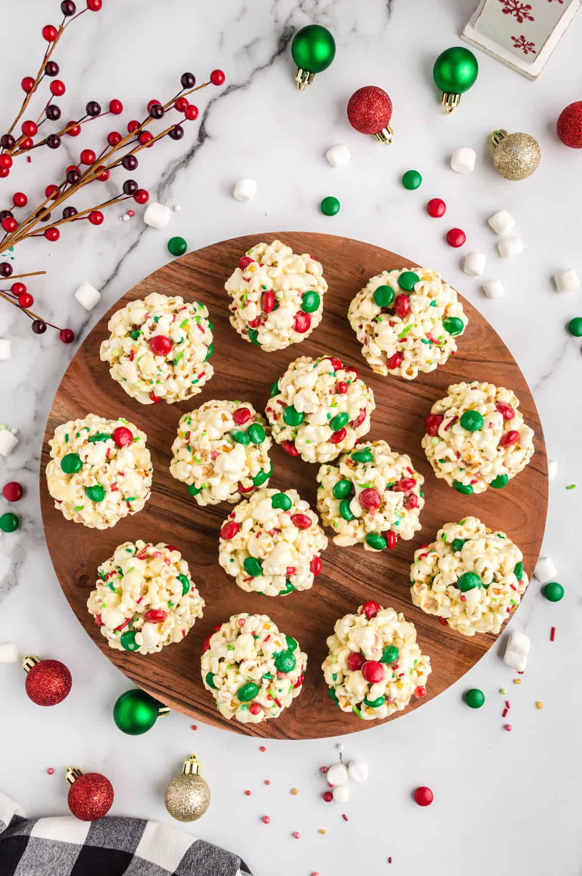 Christmas Popcorn Balls with M&Ms on round serving platter