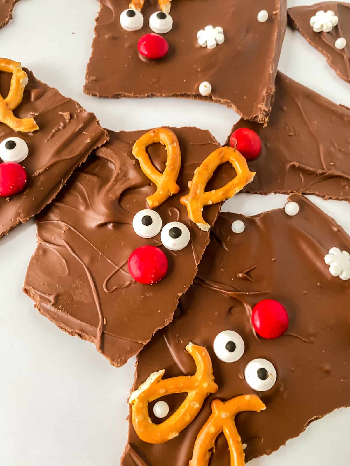Reindeer bark with pretzel ears, candy eyes, and red M&M nose