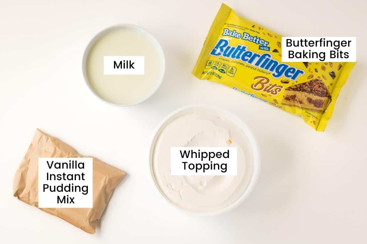bowl of milk, bowl of whipped topping, bag of Butterfinger Baking Bits, bag of instant vanilla pudding mix