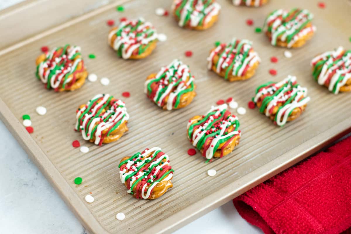 Christmas caramel pretzel bites arranged neatly in rows on serving tray