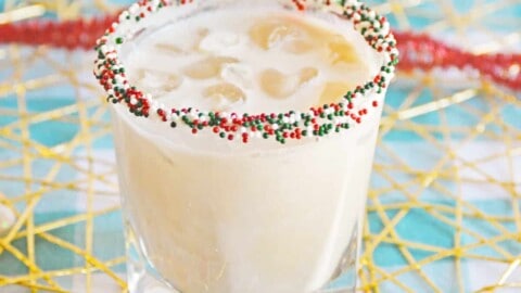 Christmas Cookie Cocktail with vodka in a christmas sprinkle rimmed glass