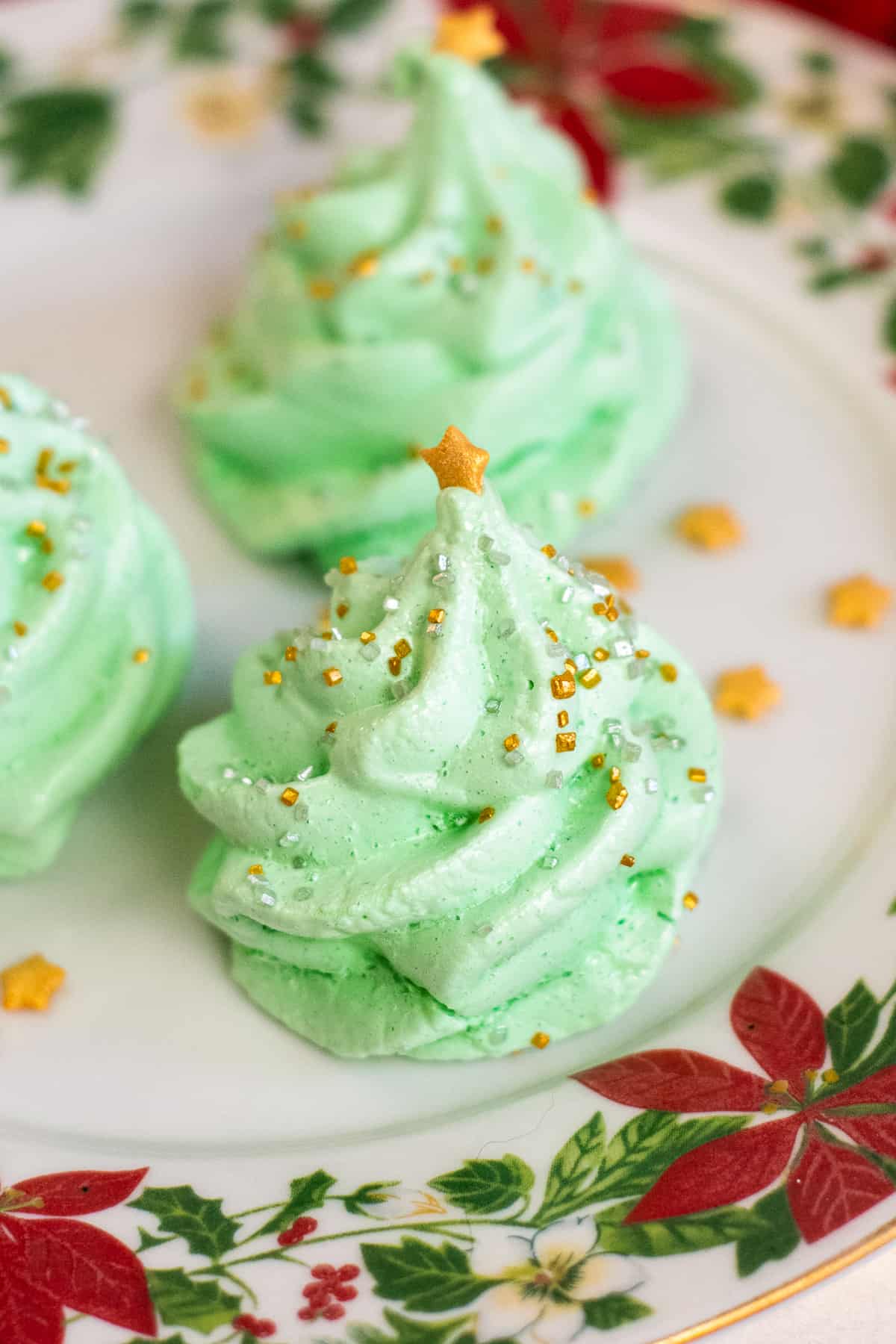 Christmas Tree Meringue Cookies decorated with gold star and sprinkles
