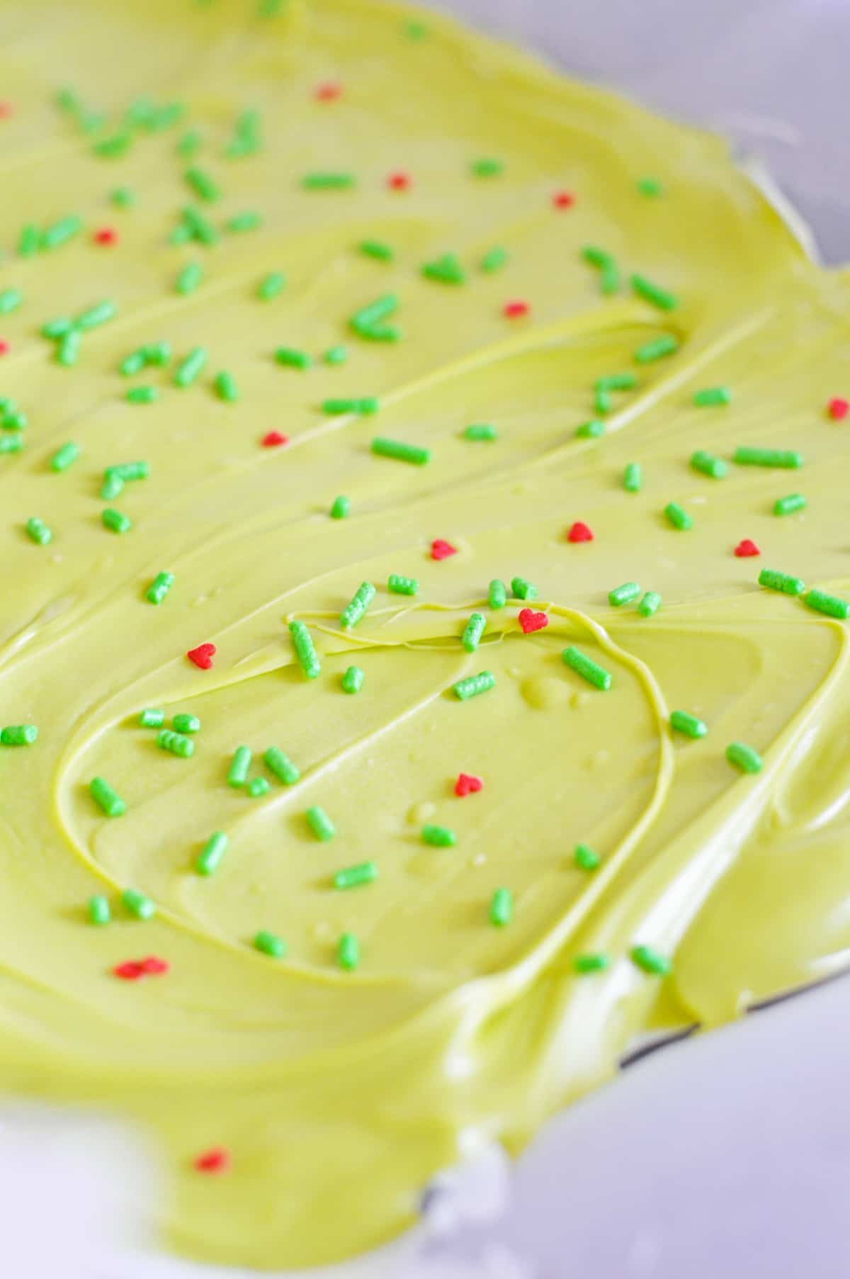 Grinch Bark on parchment lined baking sheet