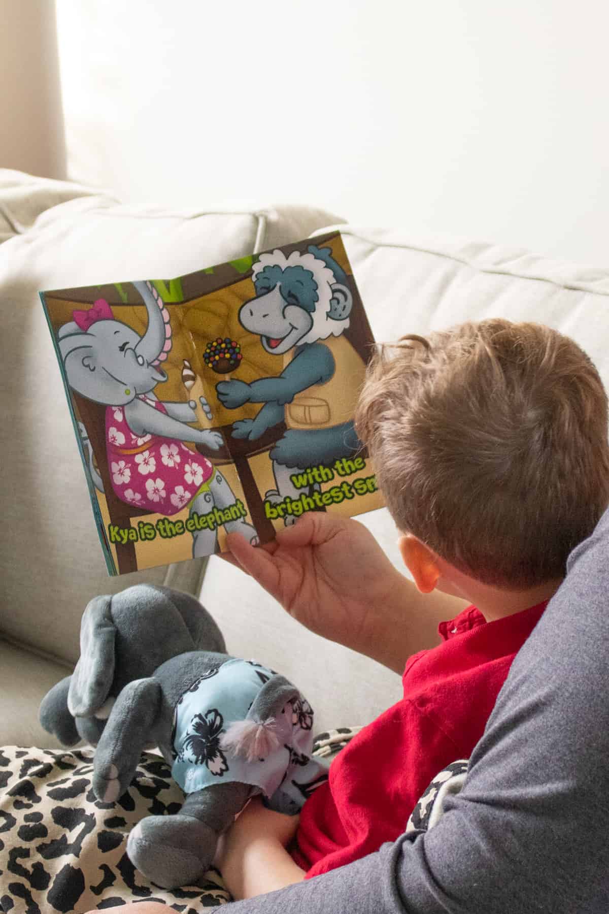 mother reading book to young boy