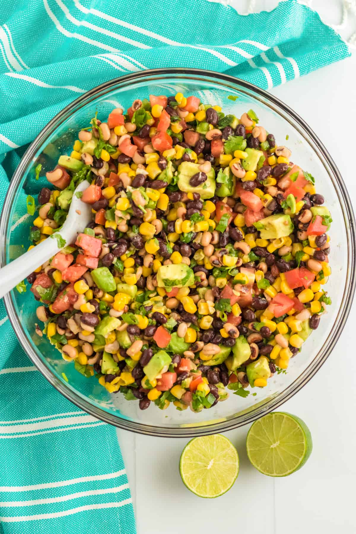 Cowboy caviar in large glass bowl with spoon