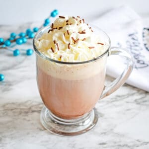 Dirty snowman boozy hot chocolate with whipped cream and chocolate sprinkles