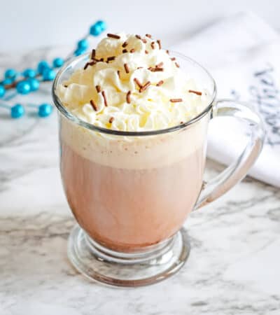 Dirty snowman boozy hot chocolate with whipped cream and chocolate sprinkles