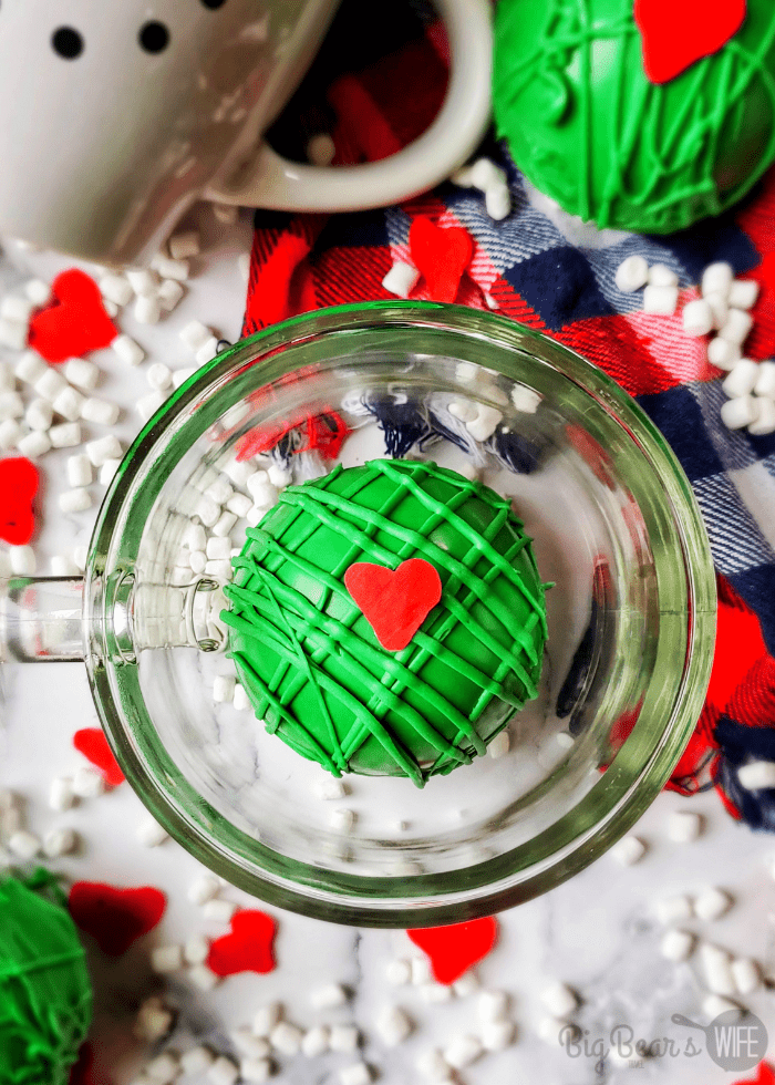 green hot chocolate bomb with red heart sprinkle on top