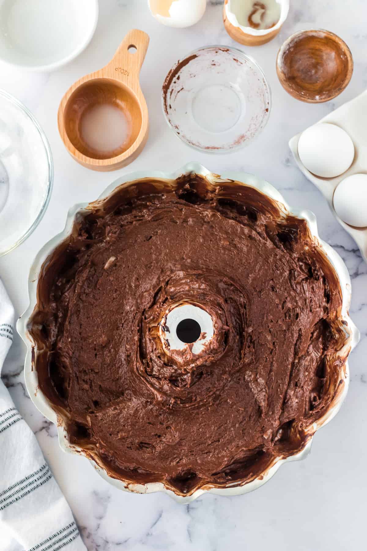 Chocolate coconut cake batter in bundt pan.