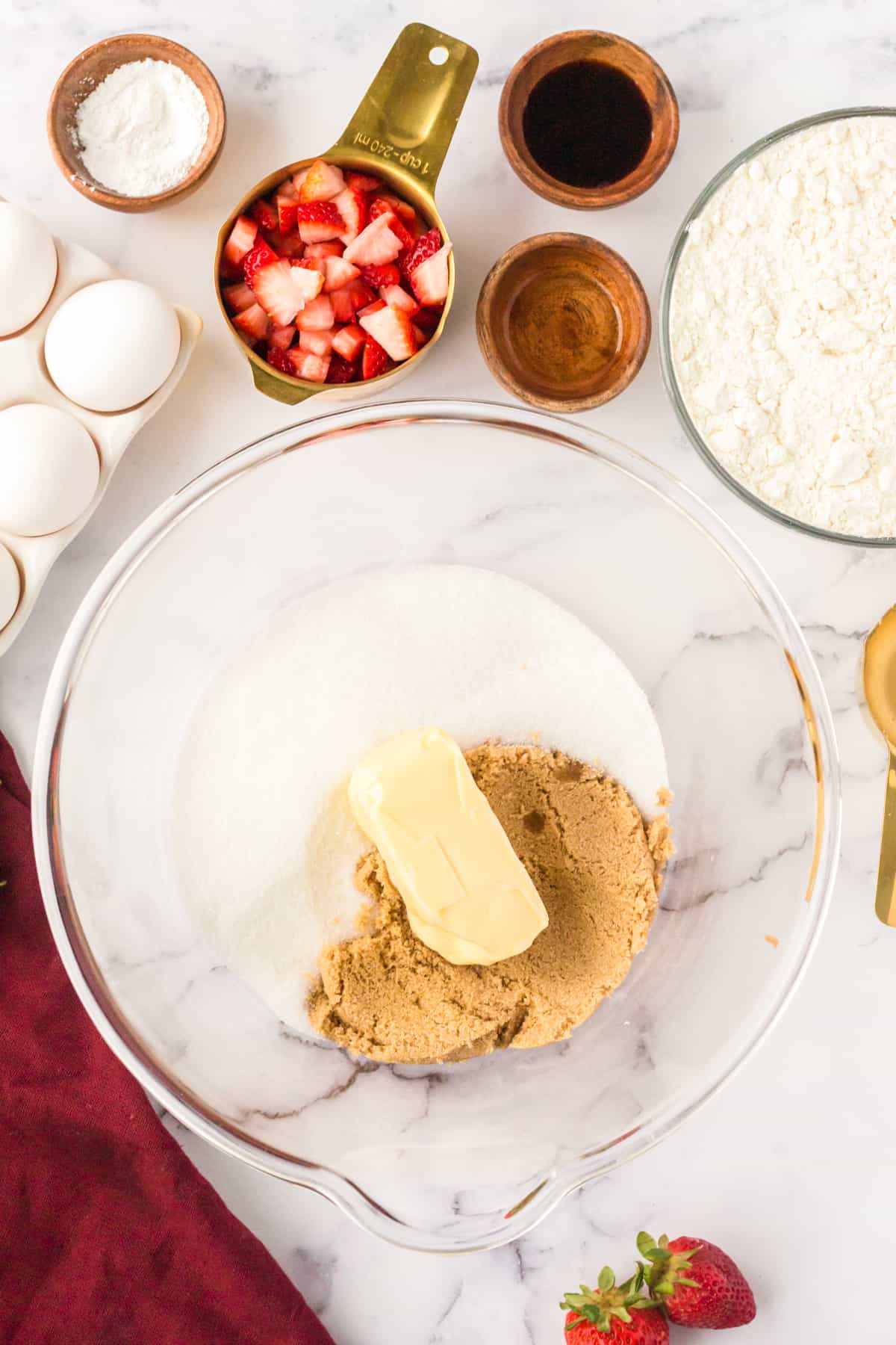 Large mixing bowl with granulated sugar, brown sugar, and butter. 