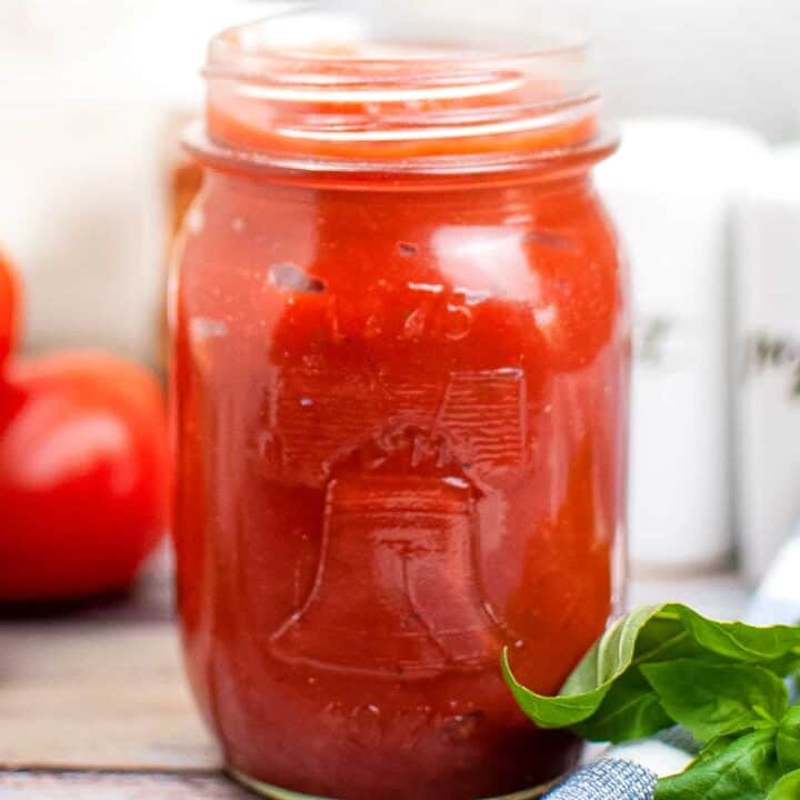 homemade pizza sauce in mason jar on wooden table