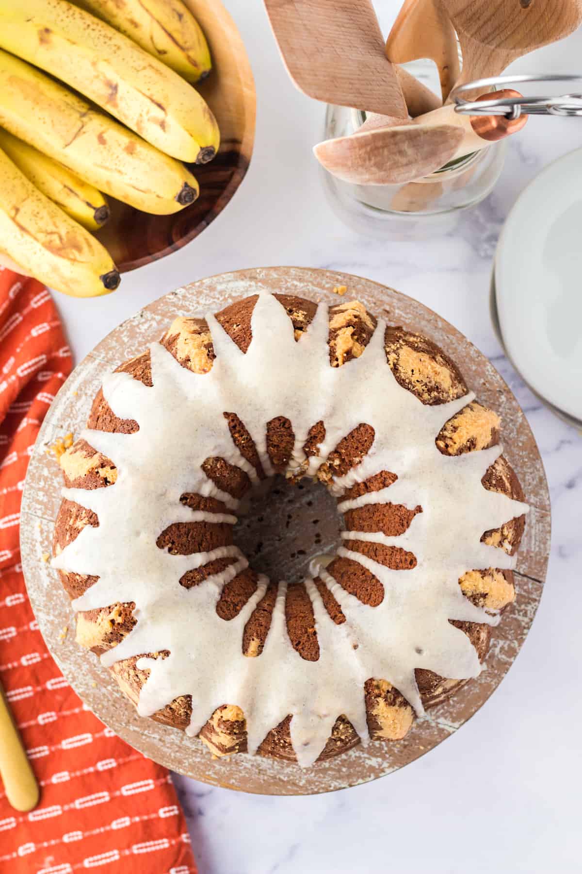 Banana Bundt Cake with brown sugar glaze poured over the top and dripping down the sides.