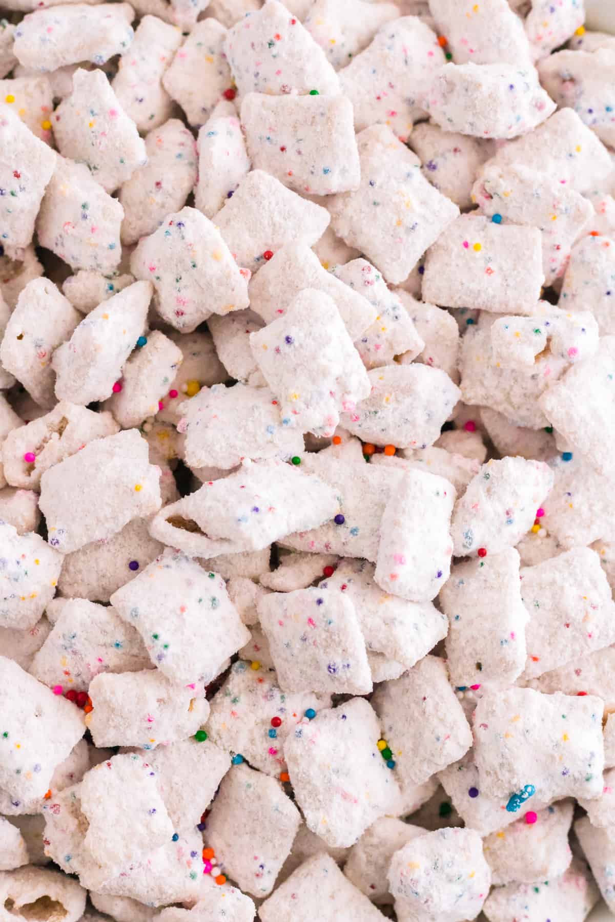 Close-up picture of funfetti puppy chow with rainbow sprinkles