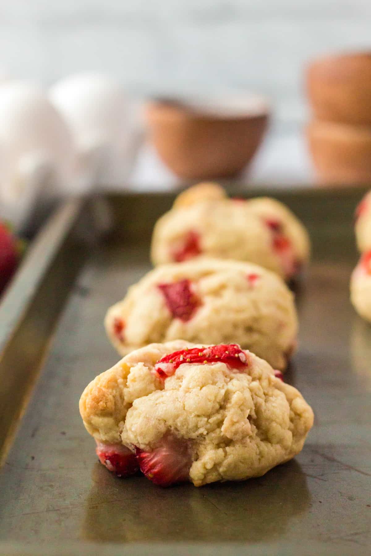 thick strawberry shortcake cookies on baking sheet