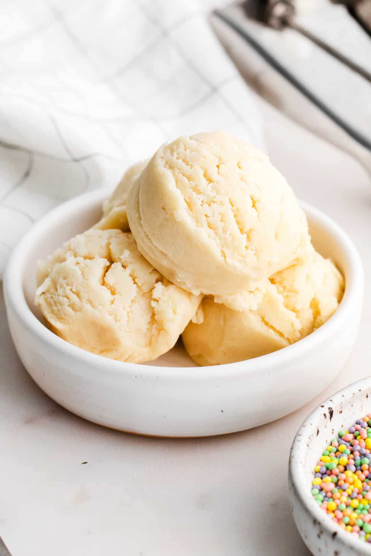 Edible Sugar Cookie Dough scooped into small white bowl