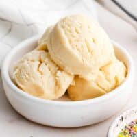 Edible Sugar Cookie Dough scooped into small white bowl.