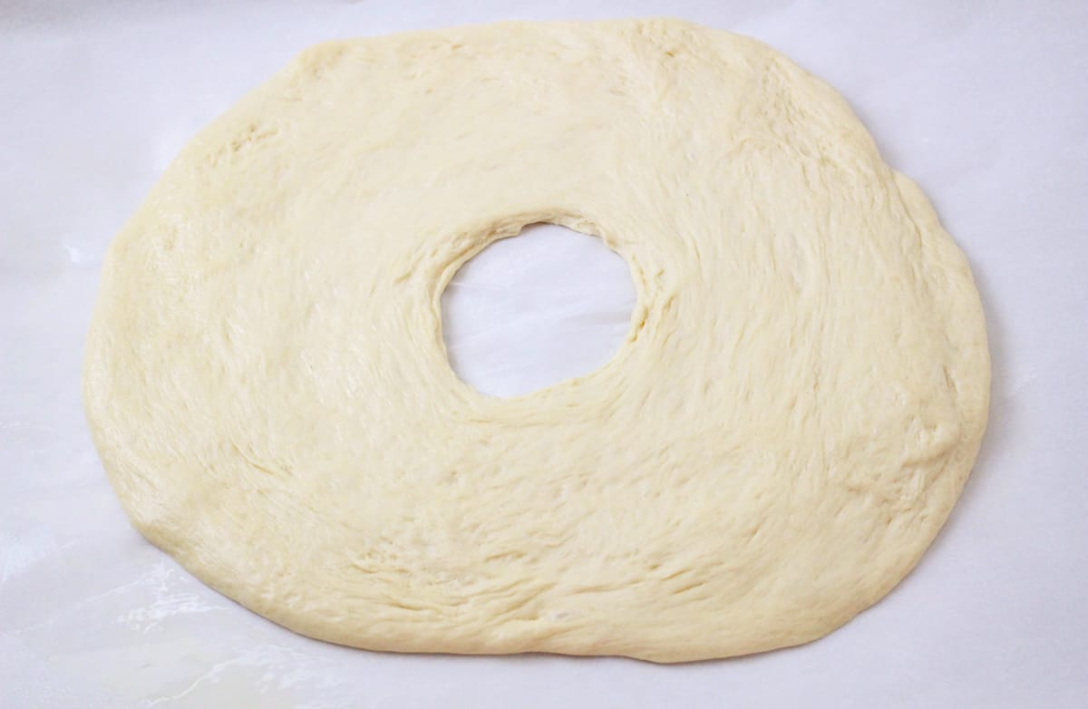Dough rolled into ring with hole in center