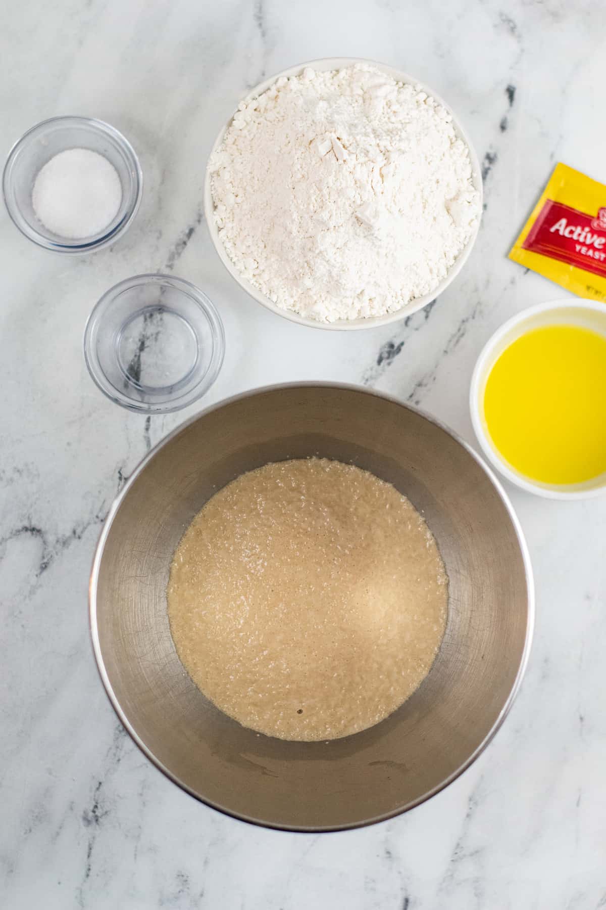Yeast, warm water, and sugar in large bowl.