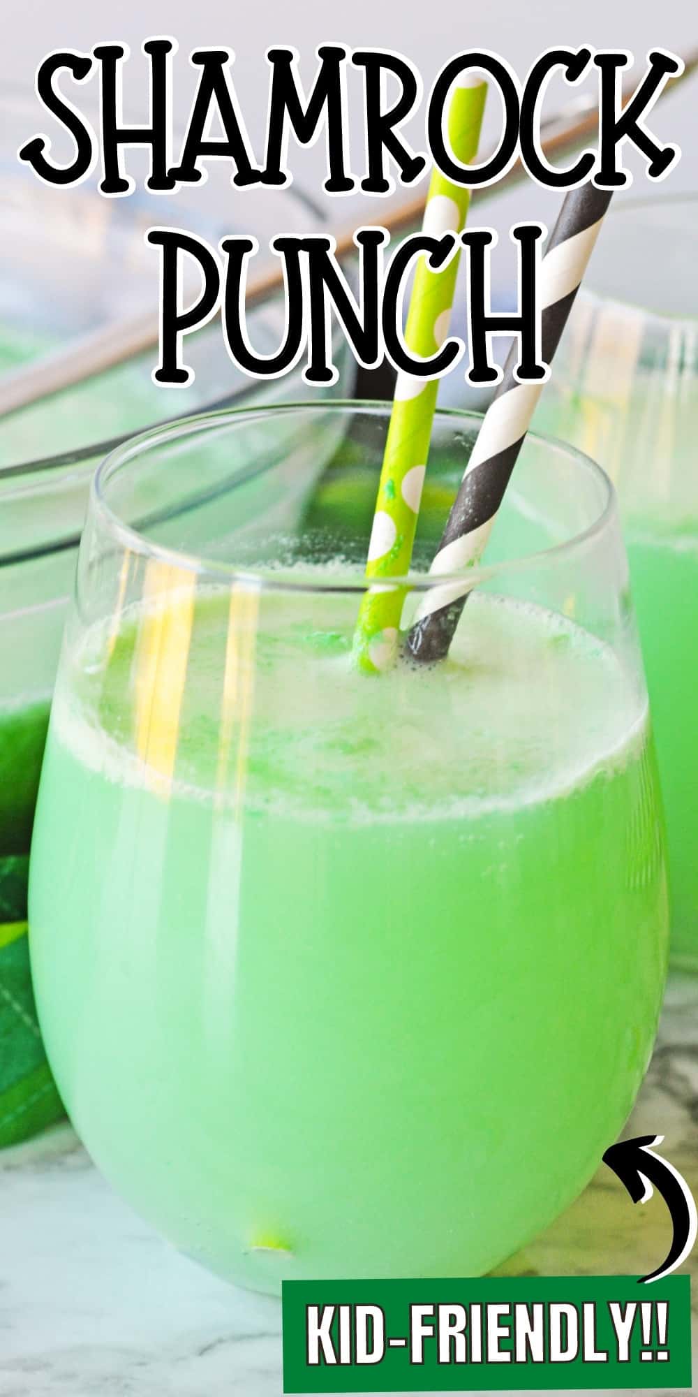 Green shamrock punch in glass with 2 paper straws. Reads: Shamrock Punch, kid-friendly!