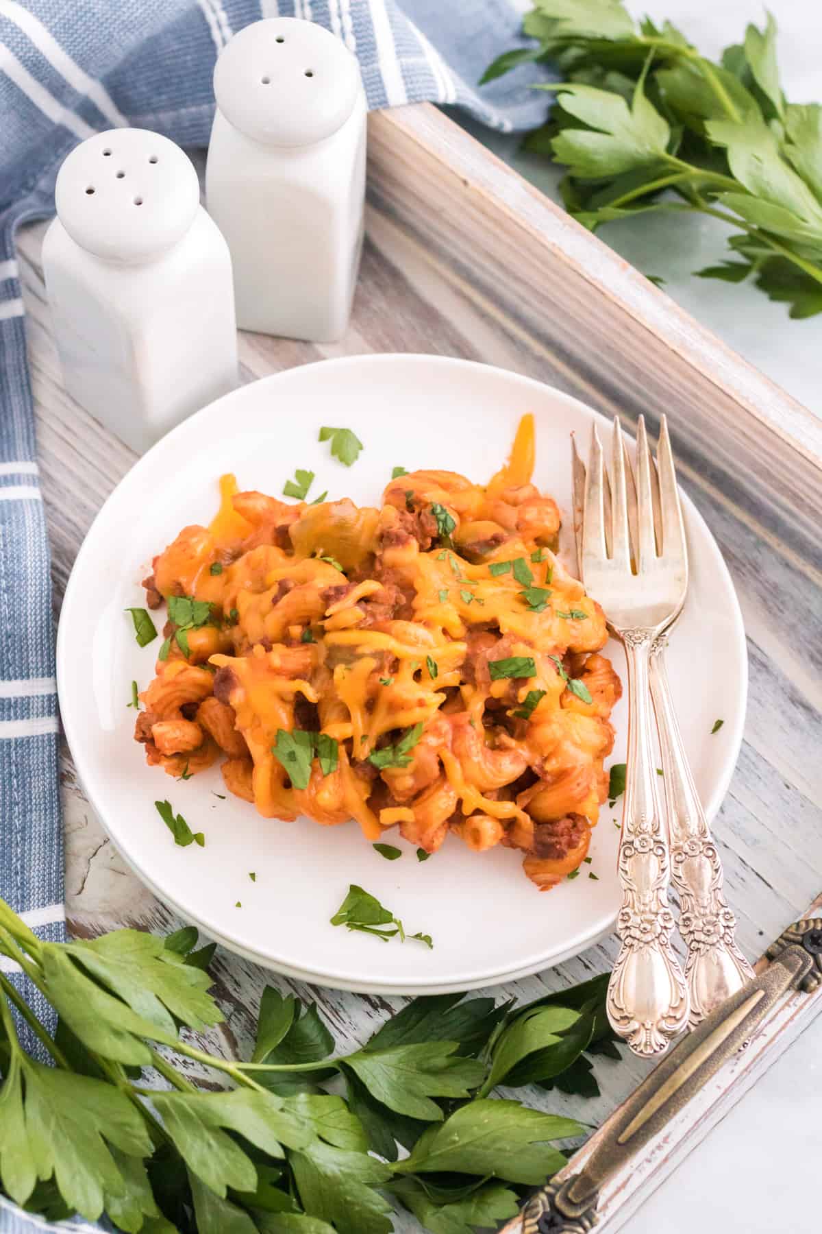 Sloppy Joe Pasta Bake served on a white plate and garnished with fresh parsley.